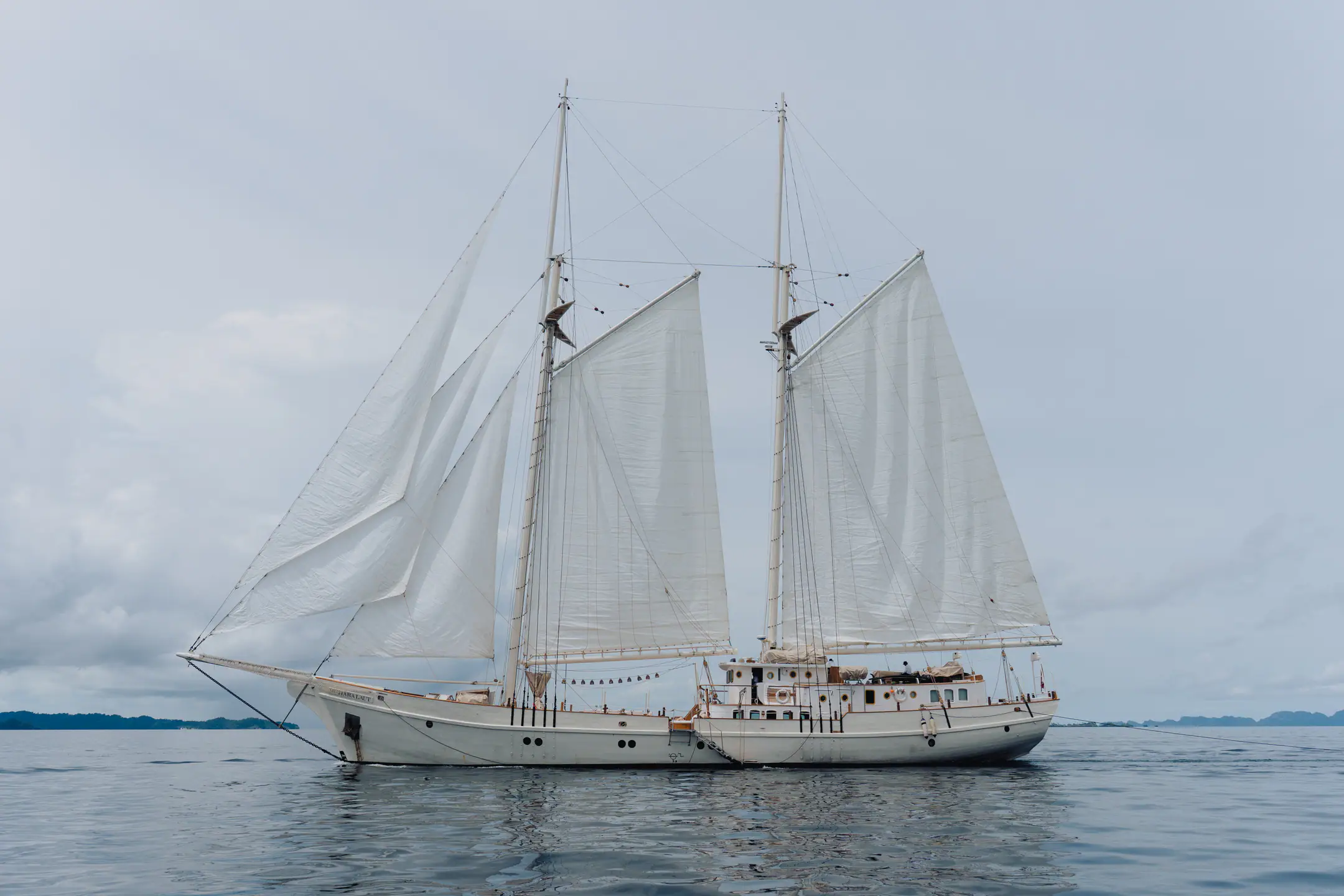 Mutiara Laut full sailing profile of the yacht cruising through open sea.