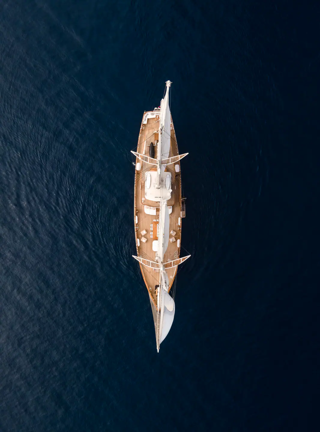 Mutiara Laut aerial view of the yacht cruising across open Indonesian waters.