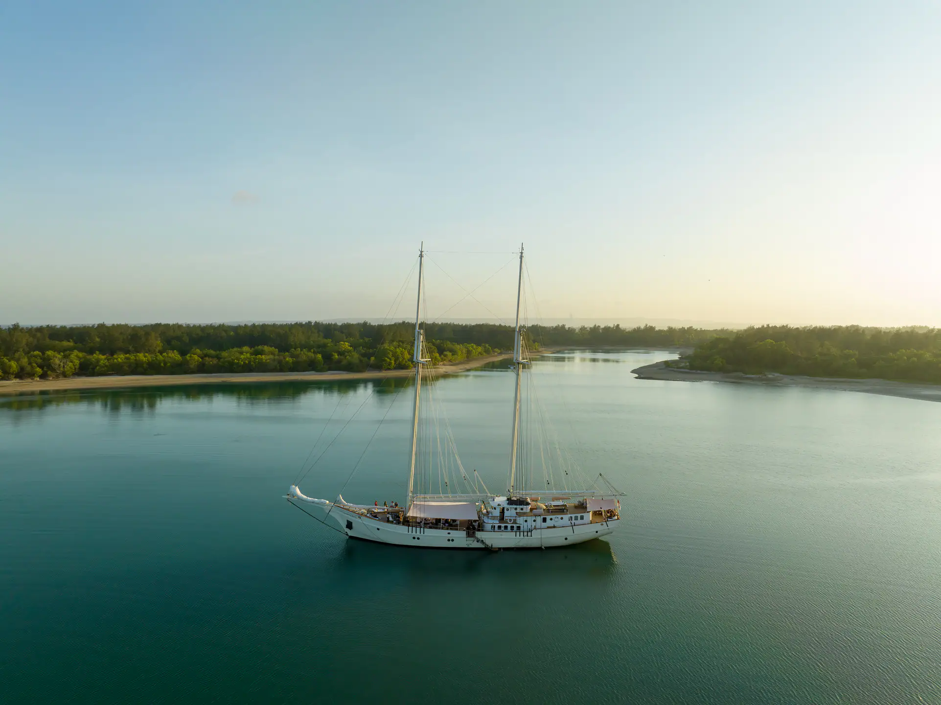Mutiara Laut sailing yacht resting in a calm tropical lagoon.