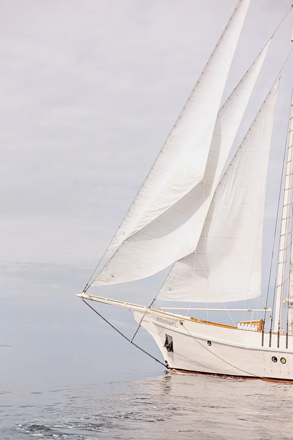 Close up on the bow of Mutiara Laut highlighting it's beautiful sails